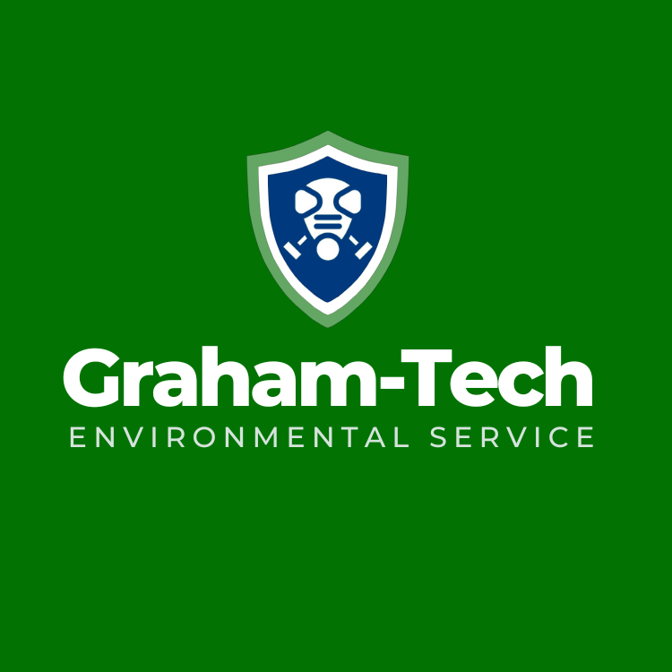 Graham-Tech reversed logo on green